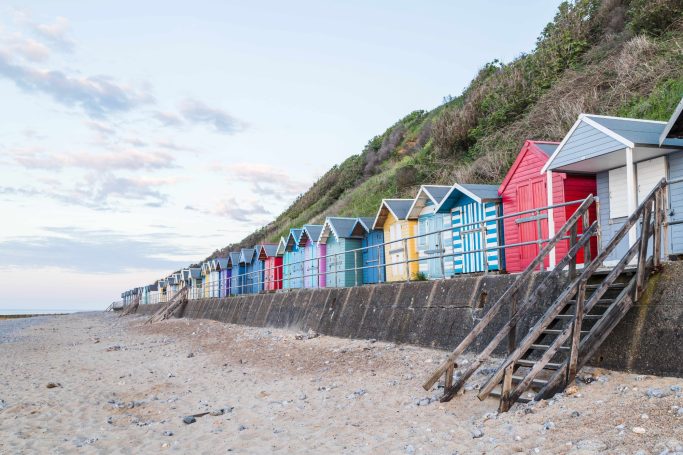 Colourful beach huts on the sea front at Cromer