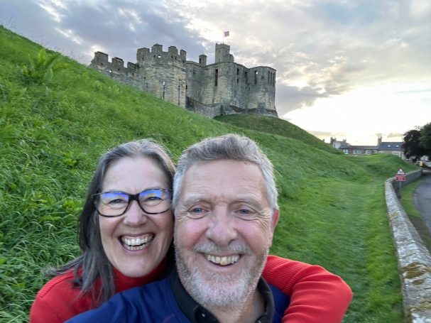 Mark Avery and Katherine Deeley below Bamburgh Castle