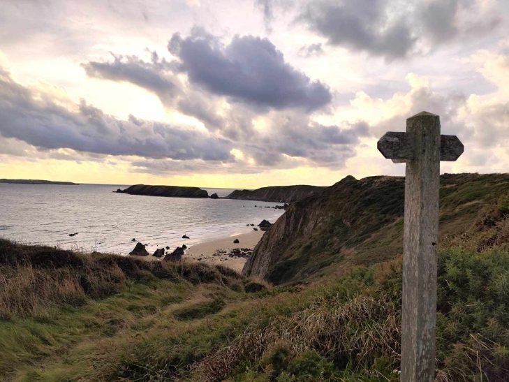 Marloes beach with wooden sign 