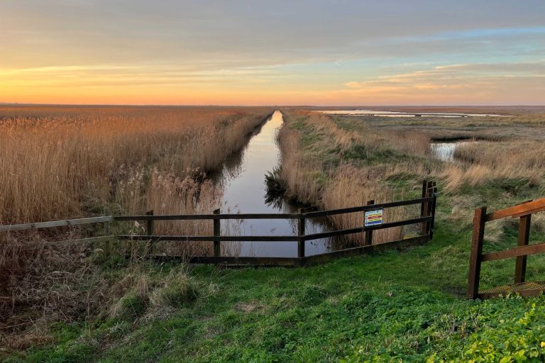 Looking over the marsh land at sun set at Cley-next-the-Sea